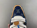 Louis Vuitton LV Trainer in deep royal blue, brown, and denim.