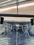 Dior distressed and ripped washed denim jeans with letter patch