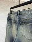 Dior distressed and ripped washed denim jeans with letter patch