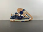Louis Vuitton LV Trainer in deep royal blue, brown, and denim.