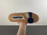 Louis Vuitton LV Trainer in deep royal blue, brown, and denim.