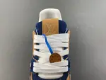 Louis Vuitton LV Trainer in deep royal blue, brown, and denim.