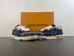 Louis Vuitton LV Trainer in deep royal blue, brown, and denim.