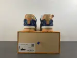 Louis Vuitton LV Trainer in deep royal blue, brown, and denim.