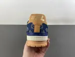 Louis Vuitton LV Trainer in deep royal blue, brown, and denim.
