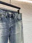 Dior distressed and ripped washed denim jeans with letter patch