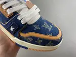 Louis Vuitton LV Trainer in deep royal blue, brown, and denim.