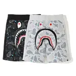 BAPE streetwear brand shark head glow-in-the-dark shorts with side paneling