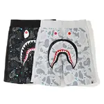 BAPE streetwear brand shark head glow-in-the-dark shorts with side paneling