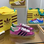 GU*I× Adidas sneakers