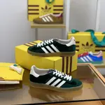 GU*I× Adidas sneakers