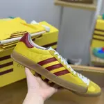 GU*I× Adidas sneakers