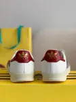 GU*I× Adidas sneakers