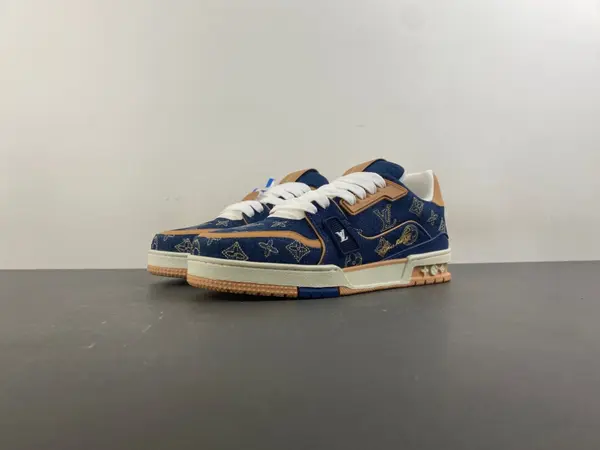 Louis Vuitton LV Trainer in deep royal blue, brown, and denim.