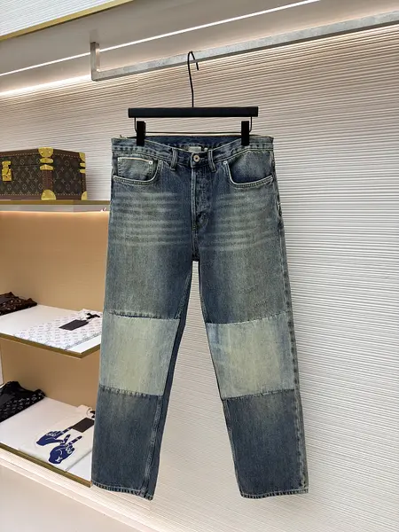 Dior distressed and ripped washed denim jeans with letter patch