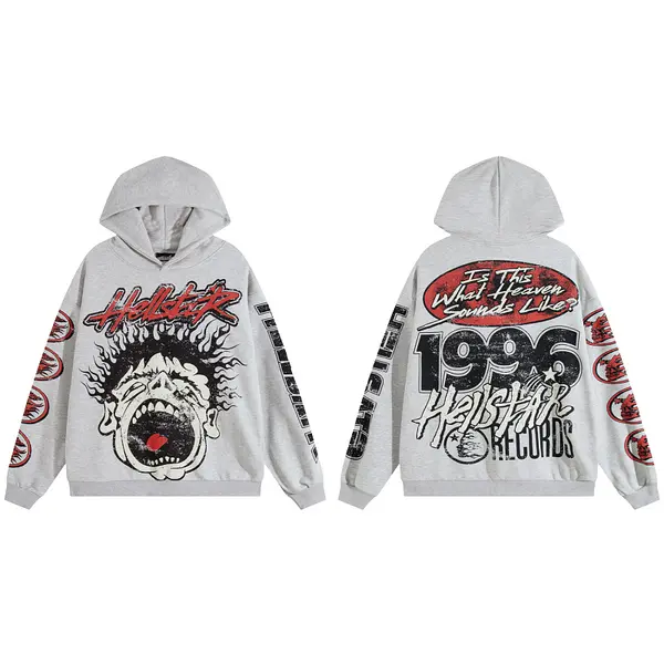 The newly popular Hellstar streetwear collection features a distressed print logo and a large portrait design on a grey hoodie
