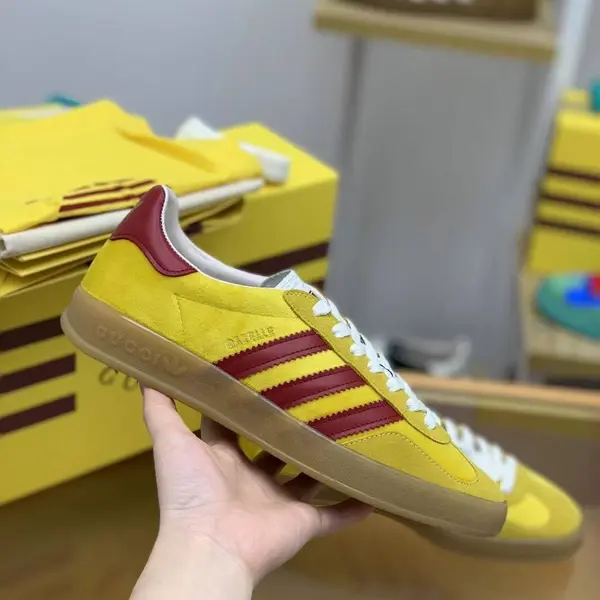 GU*I× Adidas sneakers