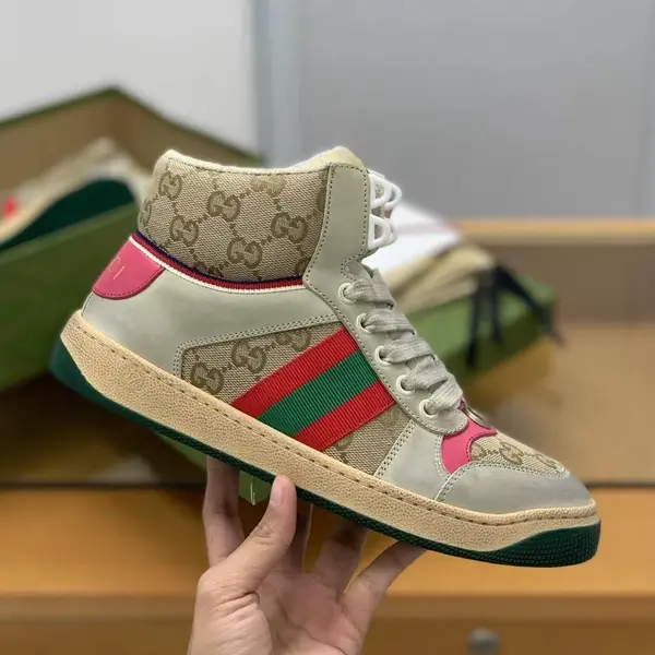 GU*IHigh-top Distressed sneakers