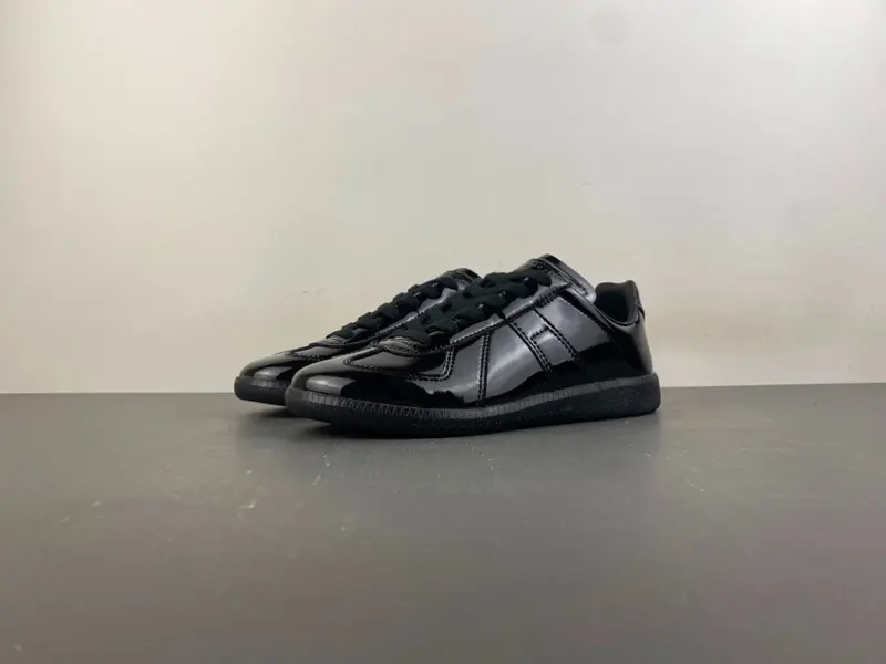Maison Margiela Replica All-Black Glossy Leather Low-Top Sneakers (Style No. S58WS0109)