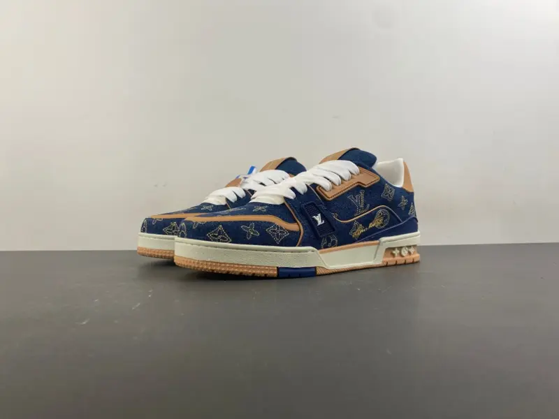 Louis Vuitton LV Trainer in deep royal blue, brown, and denim.