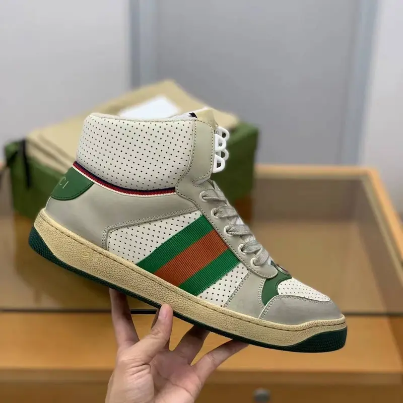 GU*IHigh-top Distressed sneakers