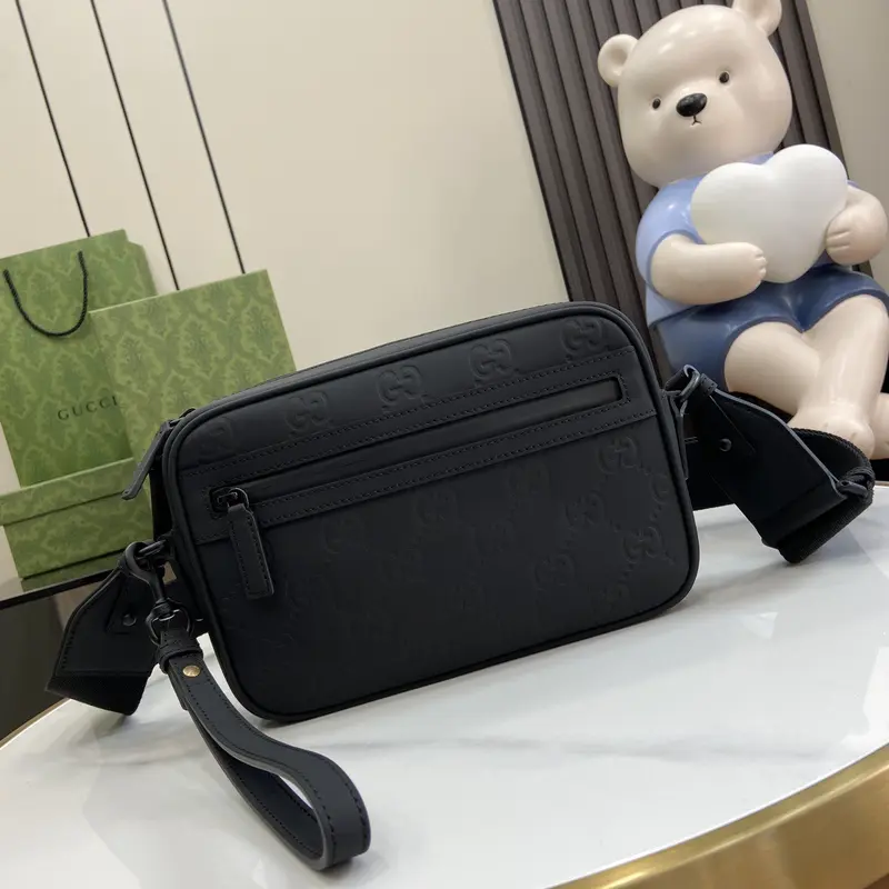 Gucci Crossbody Bags A range of men's bags in black rubber effect leather Model: 771293. Dimensions: 17* 24* 5cm